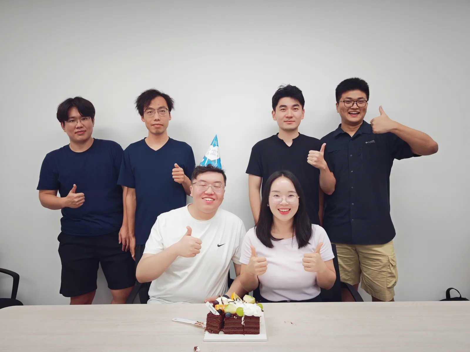 ACES Lab members celebrating together with a cake